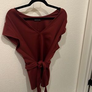 Modern top with belt. Size XL. Like new